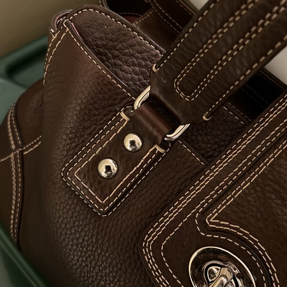 Coach purse in chocolate brown with rich stitching detail in excellent shape!